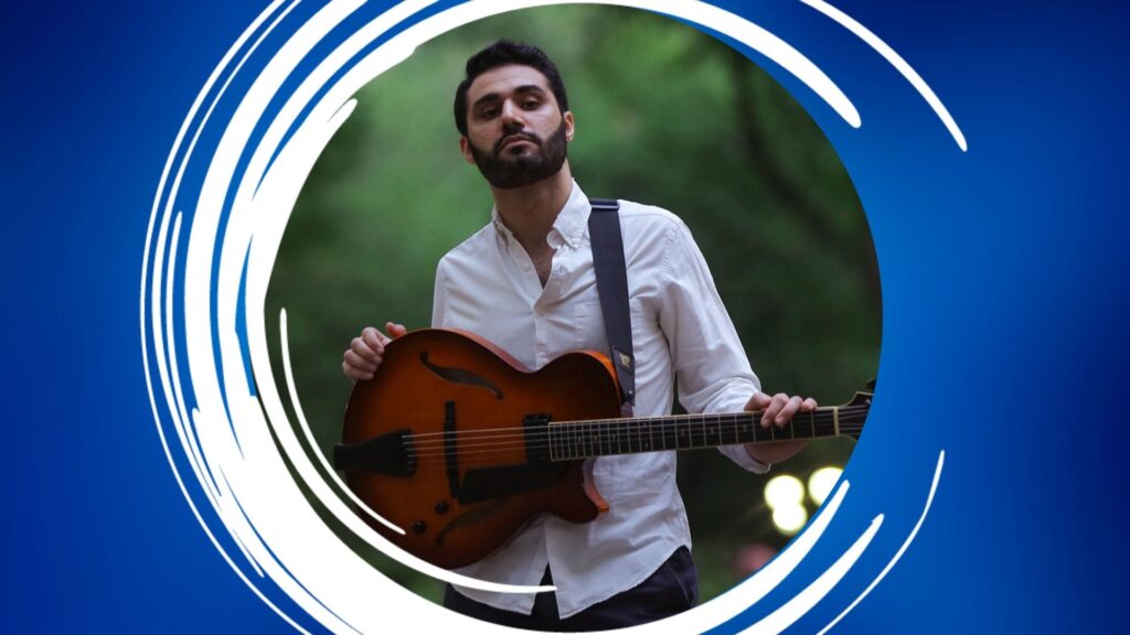 Person holding a guitar, framed by a blue and white circular design.