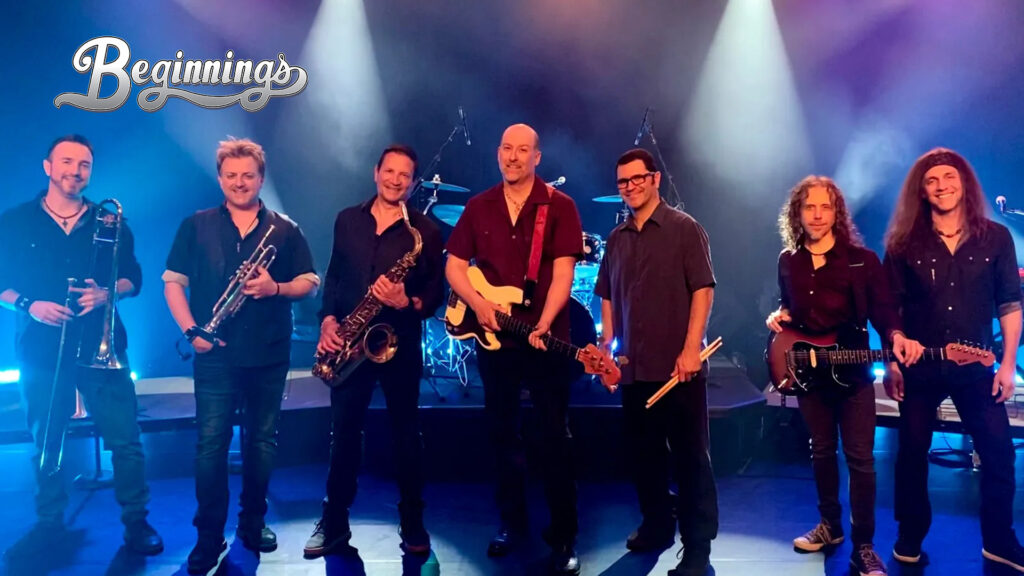A band of seven men with instruments stands on a stage with blue and purple lighting. The word "Beginnings" appears in the top left corner.