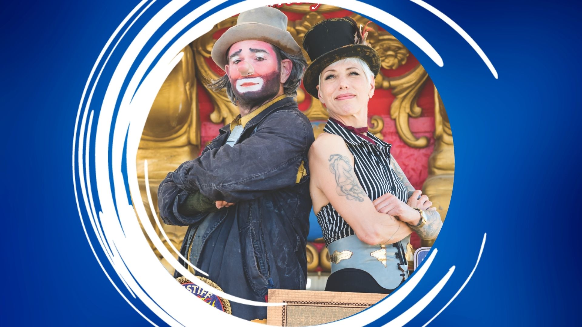 Bindlestiff – 1920×1080 Feature Two people in theatrical costumes, a clown and a formal character, standing back-to-back.