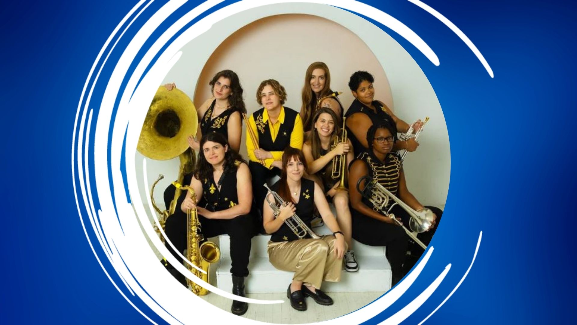 Brass Queens – 1920×1080 Feature A group of eight people with brass instruments posing in black outfits with gold details.