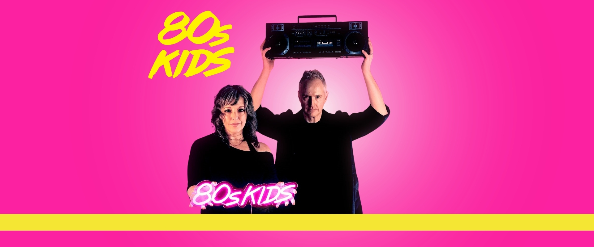 Two individuals against a pink background; a woman in a black top holds a neon pink sign reading "80s KIDS," while a man raises a boombox above his head. The bottom features a yellow stripe.