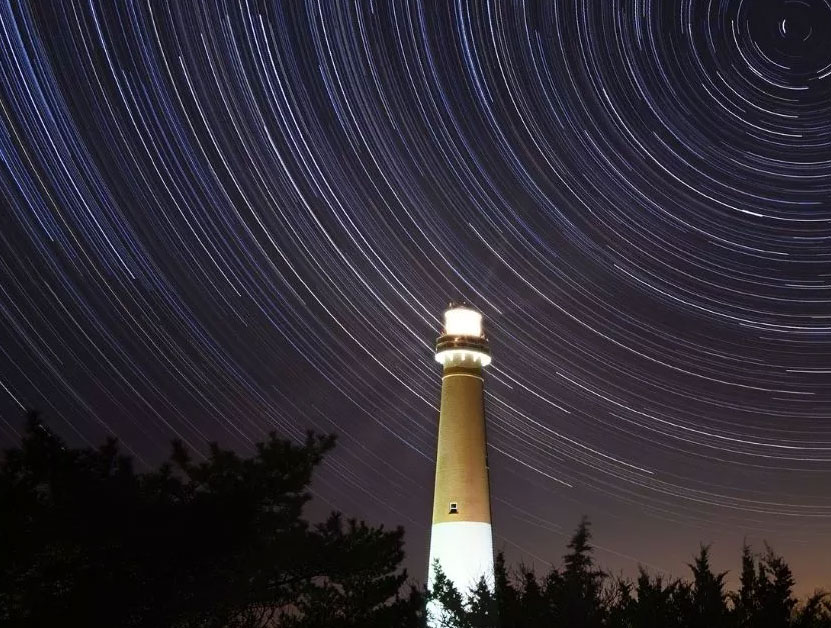light house and stars timelapse picture